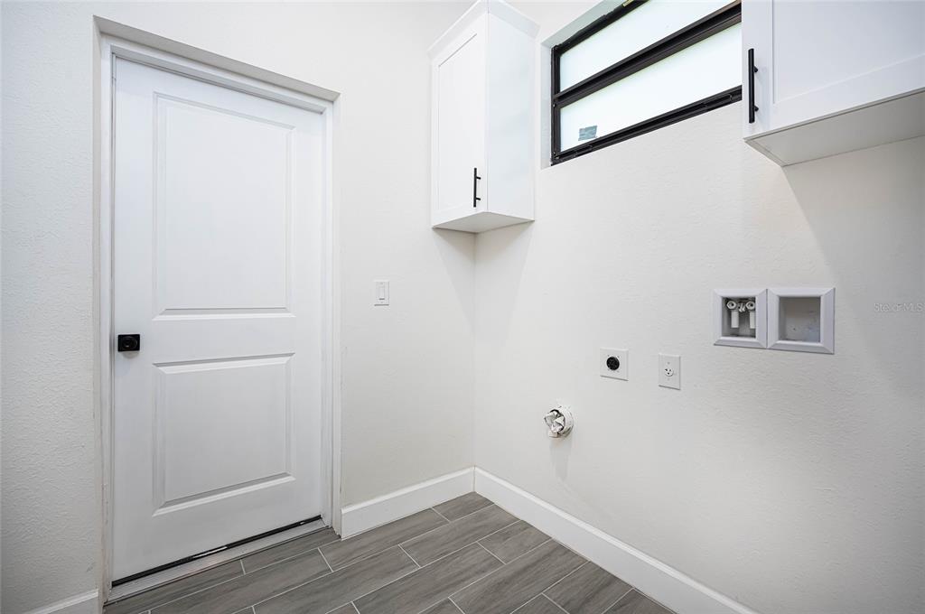 183 Sesame Road East Rotonda West, FL 33947 - Photo 32 of 59 a view of small space with wooden floor