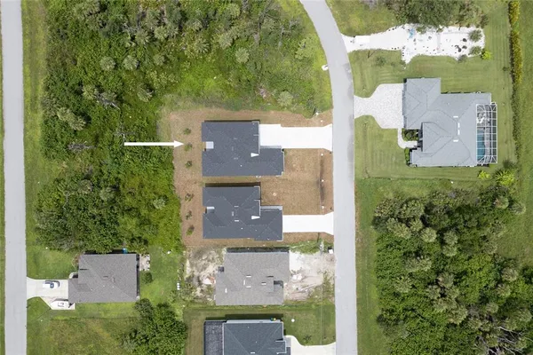 an aerial view of a house with outdoor space