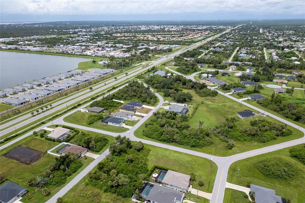 183 Sesame Road East Rotonda West, FL 33947 - Photo 46 of 59 an aerial view of residential houses with outdoor space