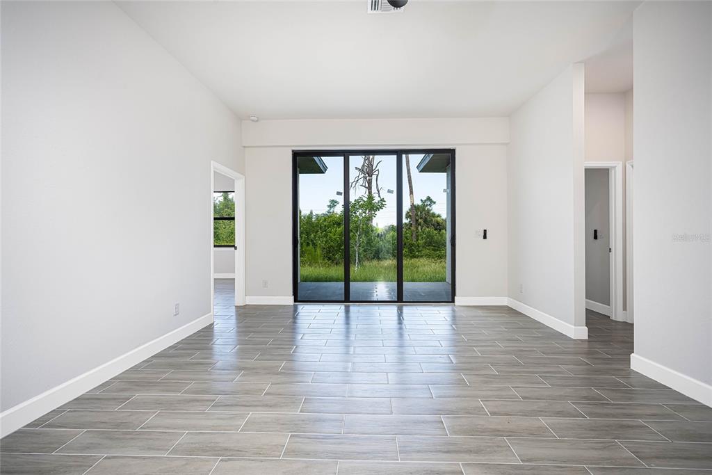 183 Sesame Road East Rotonda West, FL 33947 - Photo 6 of 59 a view of an entryway with wooden floor