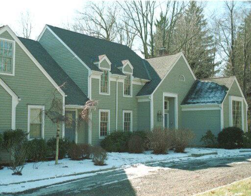 55 Ridge Common Fairfield, CT 06824 - Photo 1 of 1 a front view of a house with garden