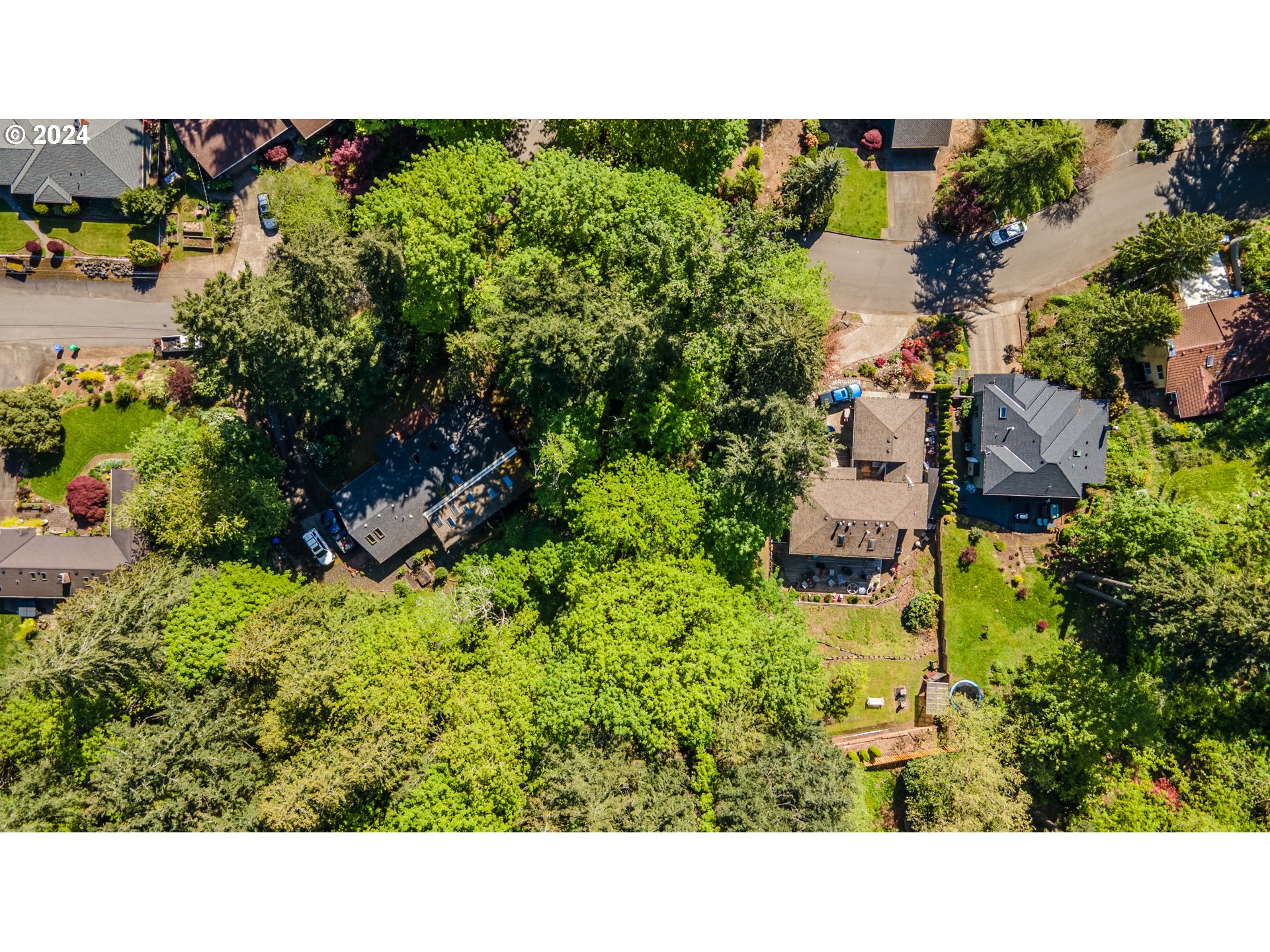 1322 Southwest Maplecrest Drive, Unit F Portland, OR 97219 - Photo 9 of 18 an aerial view of a house with a yard