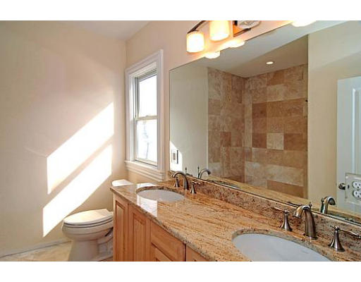 42 Nickerson Road Newton, MA 02467 - Photo 13 of 28 a bathroom with a granite countertop sink toilet a large mirror a shower and a window