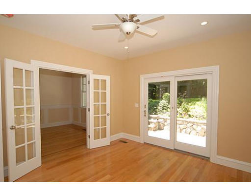42 Nickerson Road Newton, MA 02467 - Photo 18 of 28 a view of an empty room with a window and wooden floor