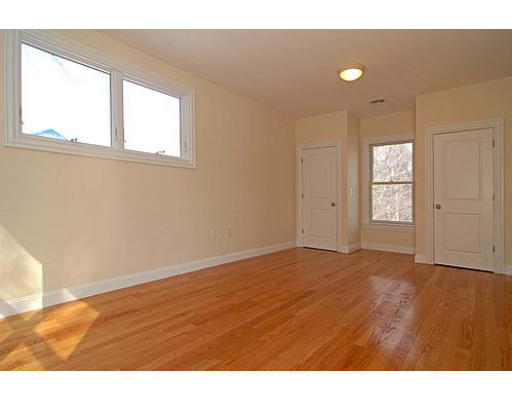 42 Nickerson Road Newton, MA 02467 - Photo 26 of 28 a view of an empty room with wooden floor and a window