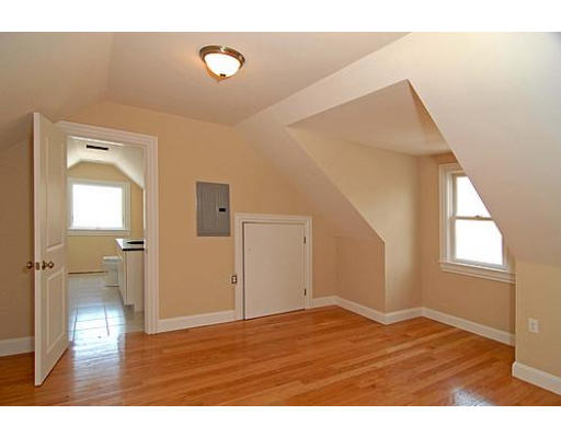42 Nickerson Road Newton, MA 02467 - Photo 27 of 28 a view of an empty room with wooden floor and a window