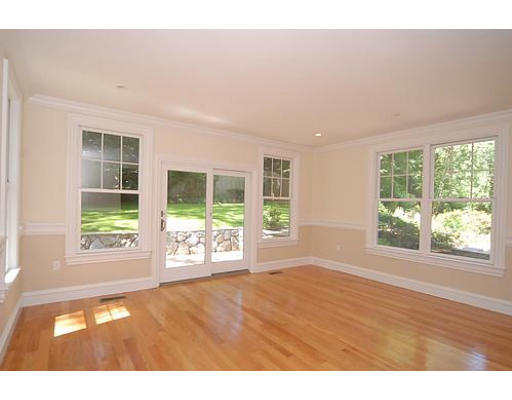 42 Nickerson Road Newton, MA 02467 - Photo 6 of 28 a view of an empty room with wooden floor and a window