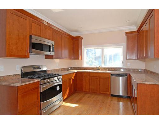 42 Nickerson Road Newton, MA 02467 - Photo 7 of 28 a kitchen with stainless steel appliances granite countertop a stove a sink and a microwave