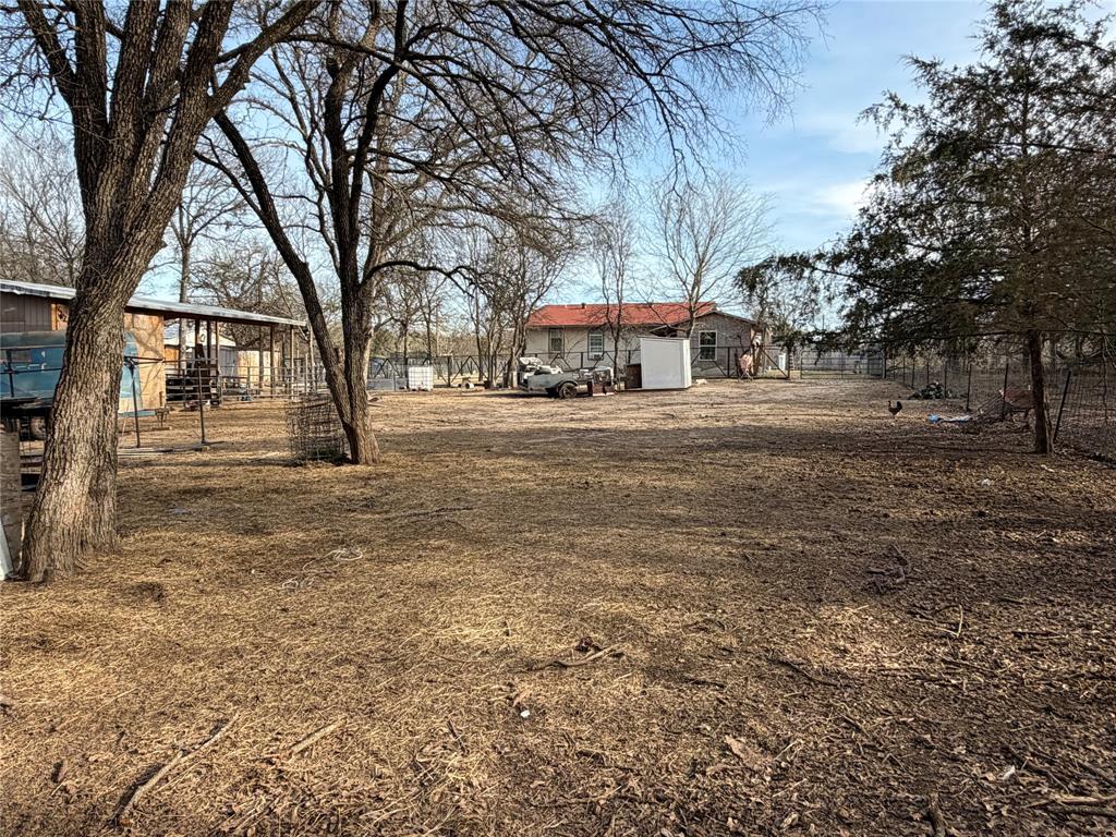 2552 Northwest 1090 Road Corsicana, TX 75110 - Photo 20 of 23 a view of a yard with a trees