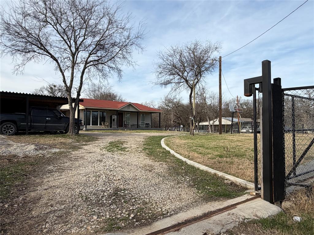 2552 Northwest 1090 Road Corsicana, TX 75110 - Photo 2 of 23 a view of a house with a yard