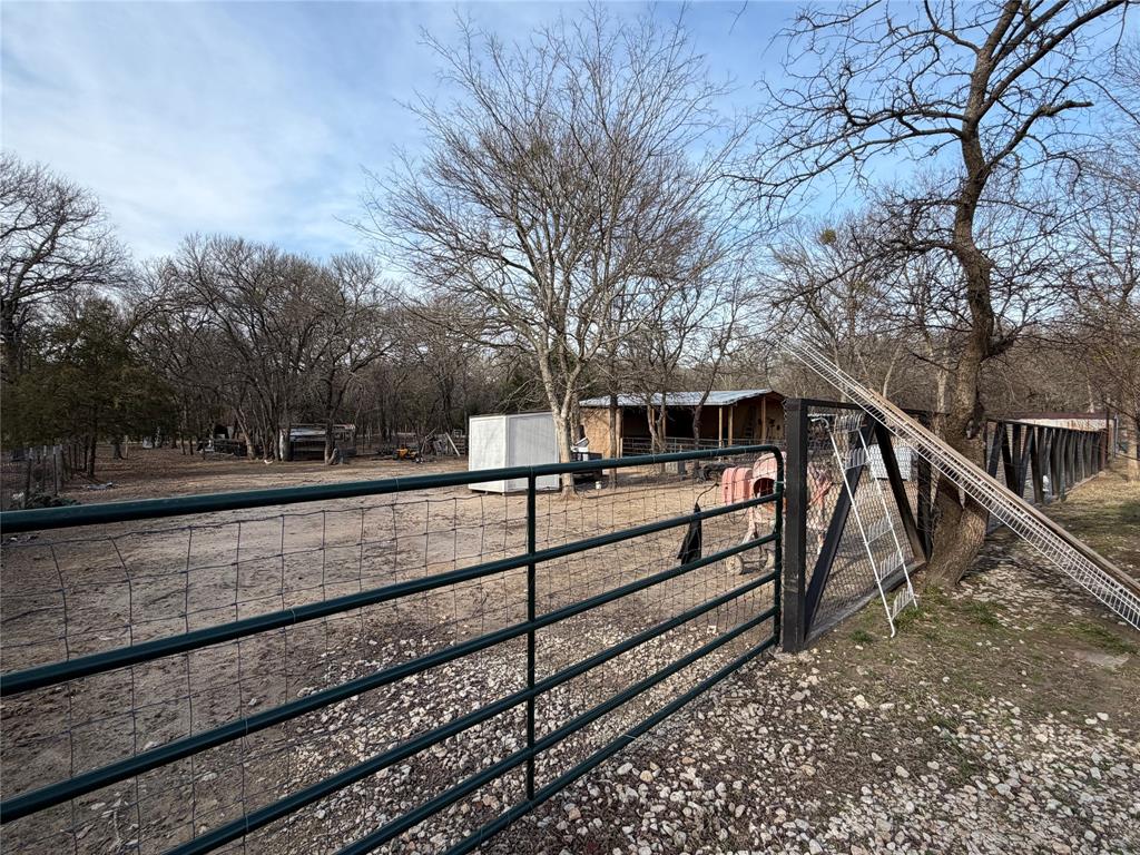 2552 Northwest 1090 Road Corsicana, TX 75110 - Photo 21 of 23 a view of a yard with wooden fence