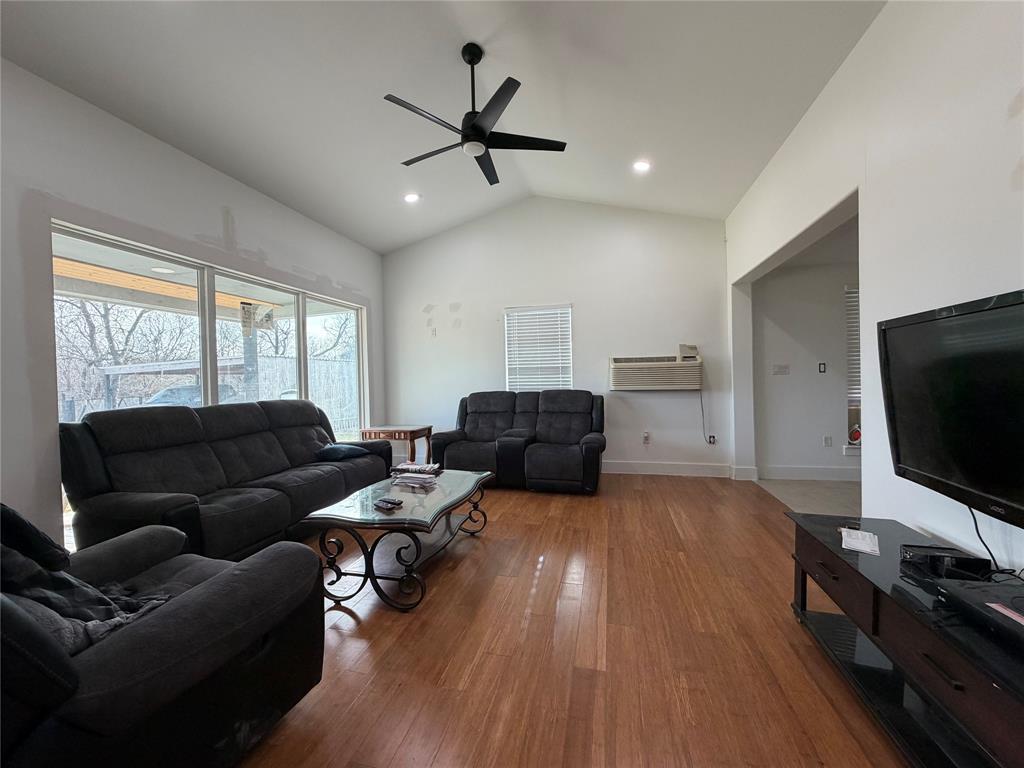 2552 Northwest 1090 Road Corsicana, TX 75110 - Photo 7 of 23 a living room with furniture and a flat screen tv