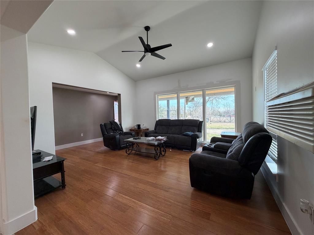 2552 Northwest 1090 Road Corsicana, TX 75110 - Photo 8 of 23 a living room with furniture and a flat screen tv
