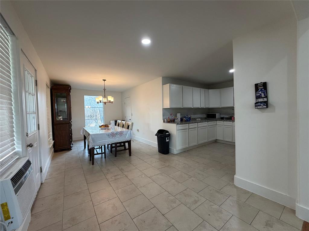 2552 Northwest 1090 Road Corsicana, TX 75110 - Photo 10 of 23 a kitchen with a sink cabinets and stainless steel appliances