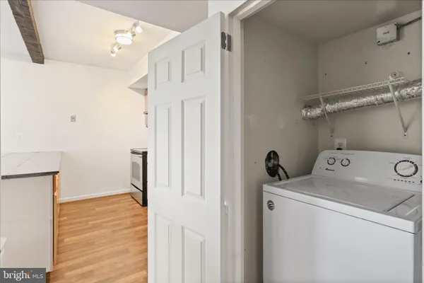 a view of storage and utility room with washer and dryer