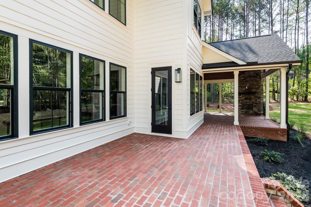 116 Silver Falls Road Troutman, NC 28166 - Photo 46 of 46 a view of a house with a porch