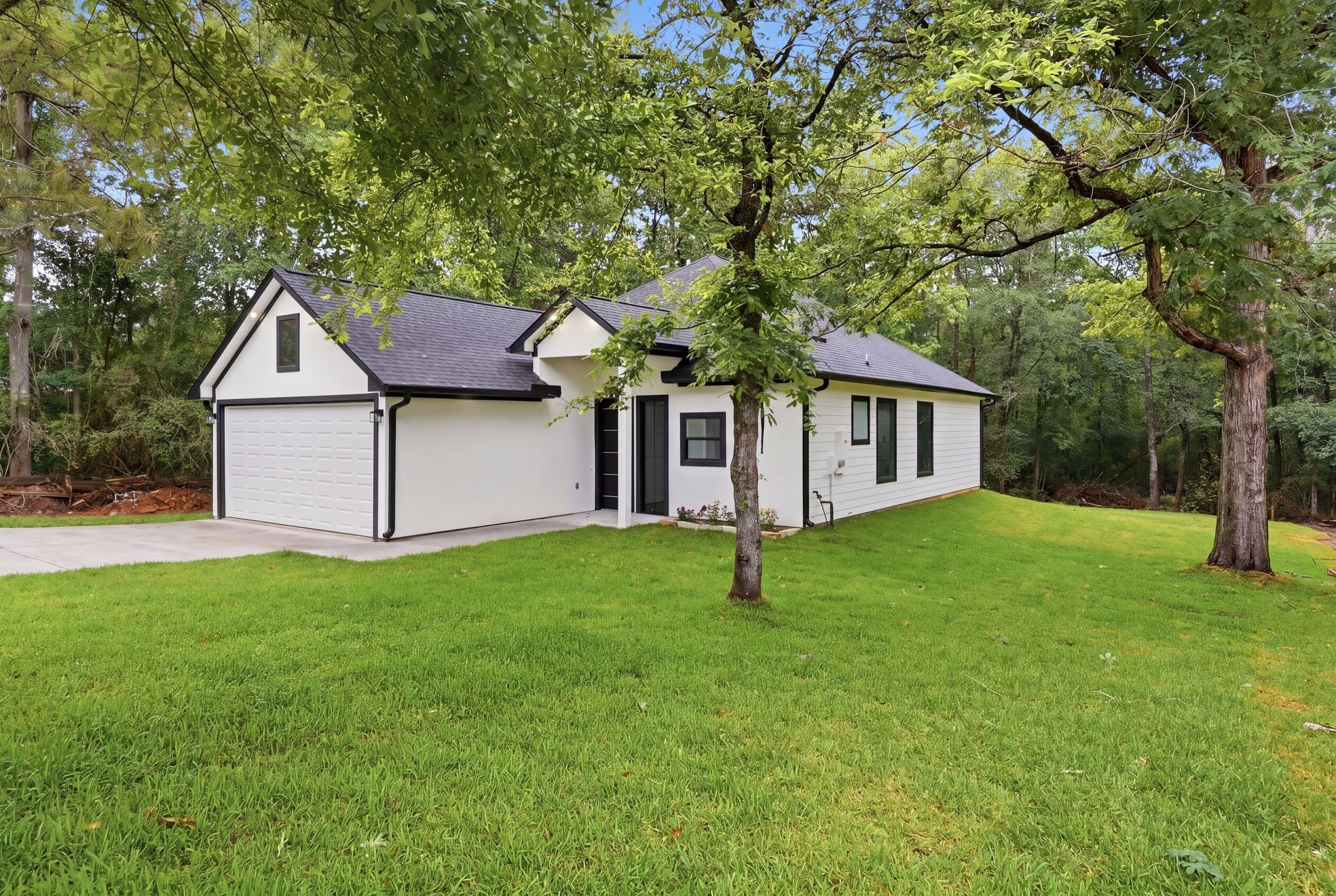 3575 Roy Bean Road Willis, TX 77378 - Photo 2 of 40 a house that has a tree in front of it