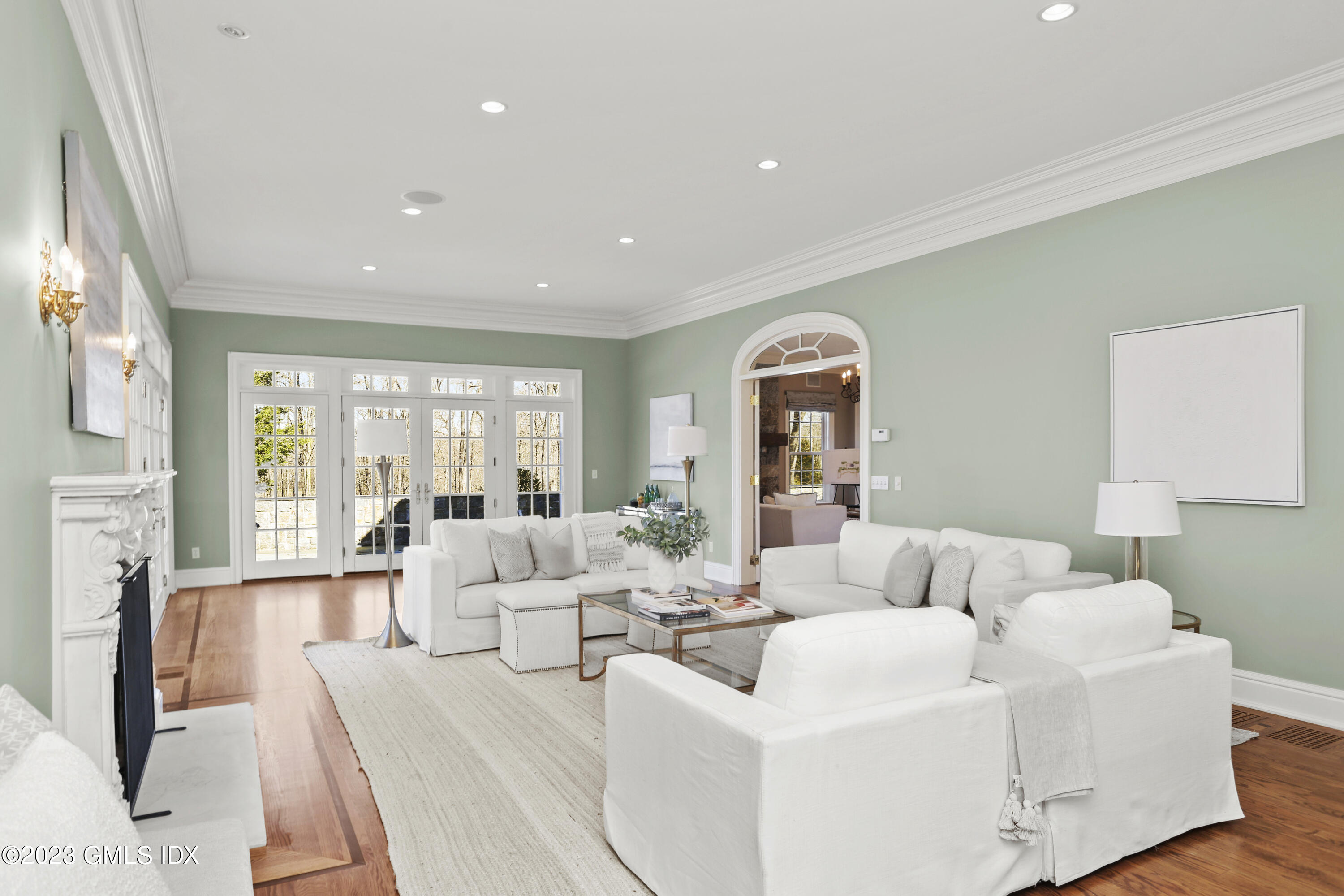 50 Byfield Lane Greenwich, CT 06830 - Photo 14 of 37 a living room with furniture fireplace and a large window