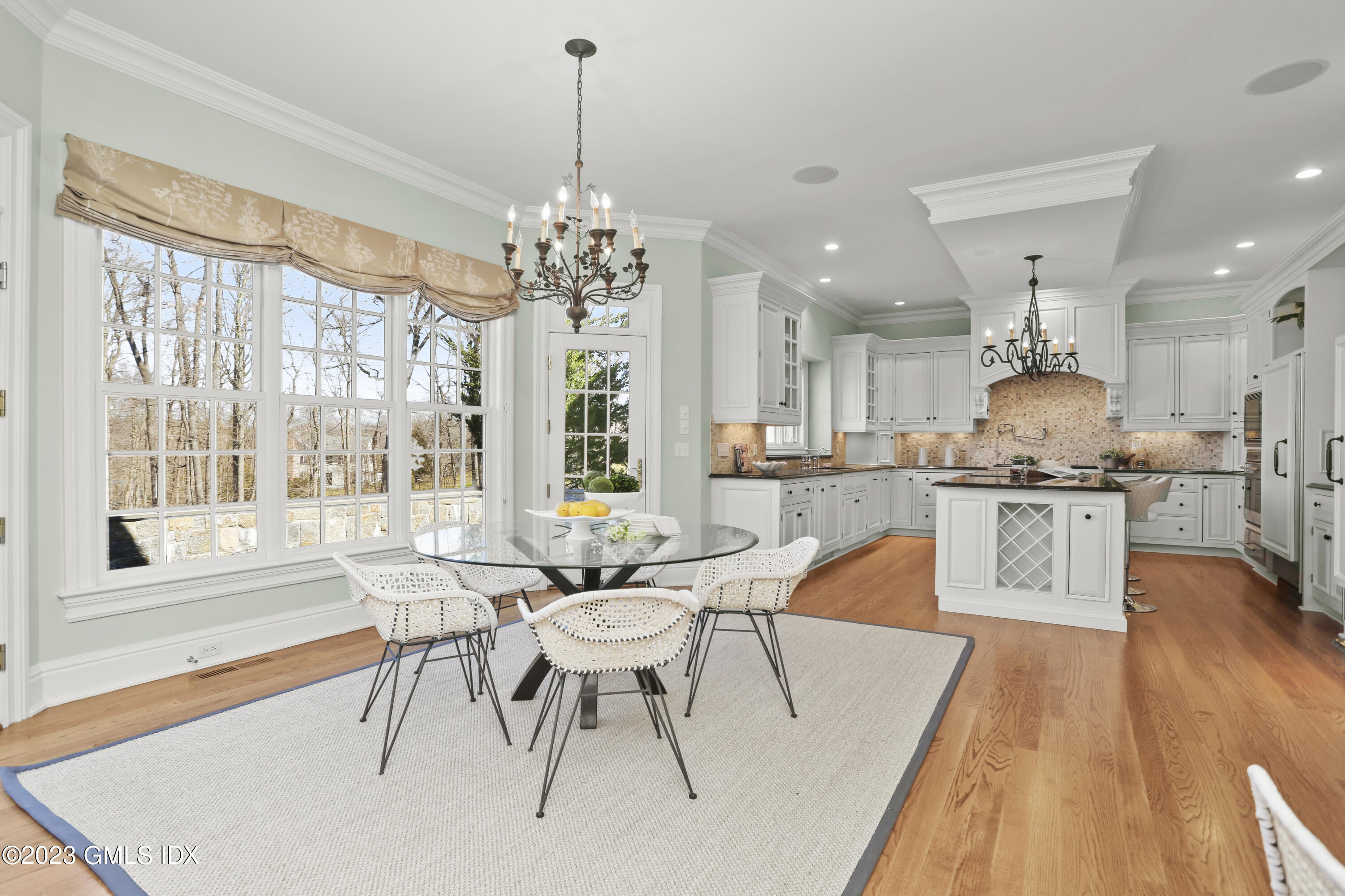 50 Byfield Lane Greenwich, CT 06830 - Photo 16 of 37 a large kitchen with a table and chairs