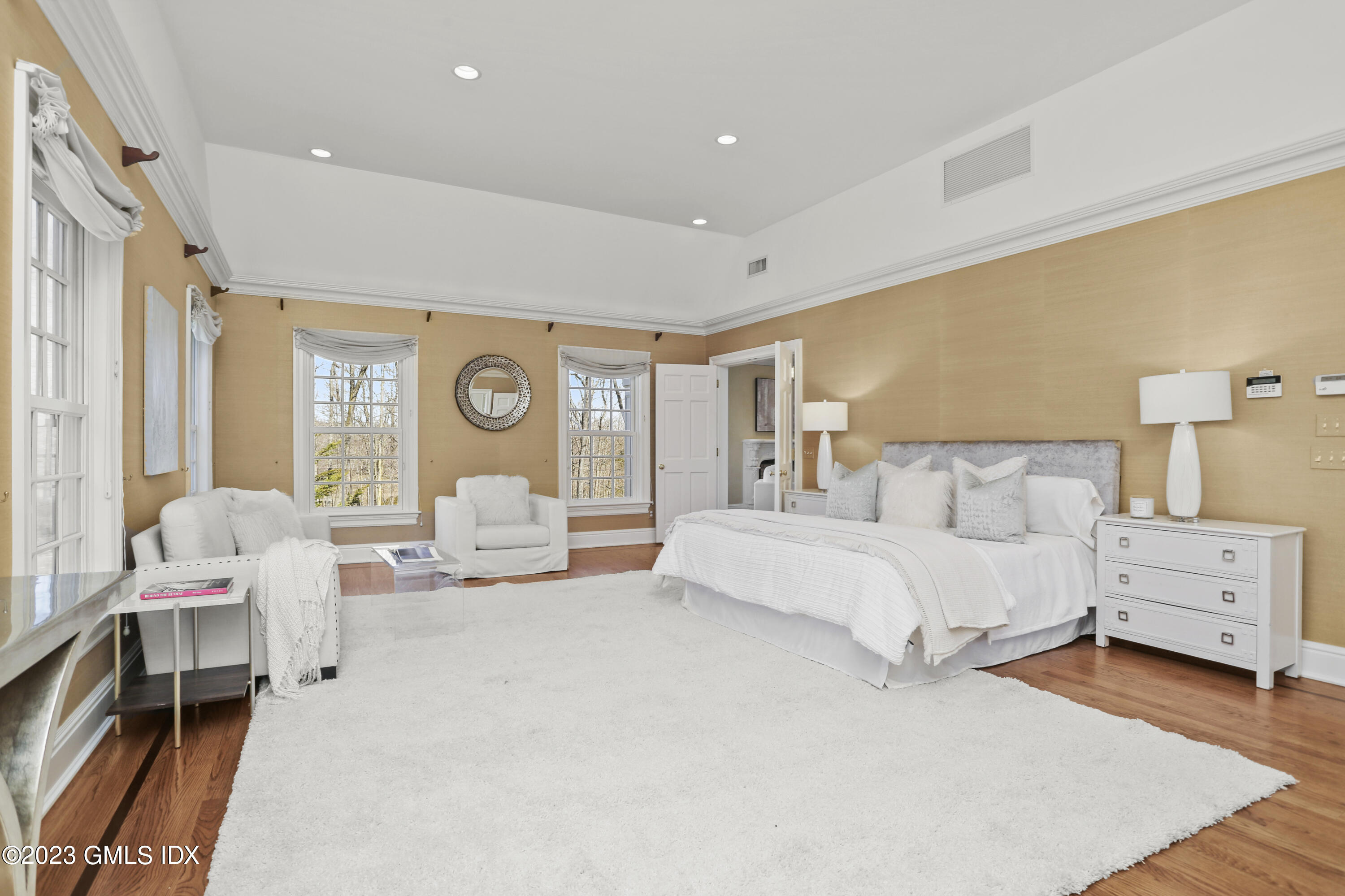 50 Byfield Lane Greenwich, CT 06830 - Photo 18 of 37 a spacious bedroom with a bed and a couch