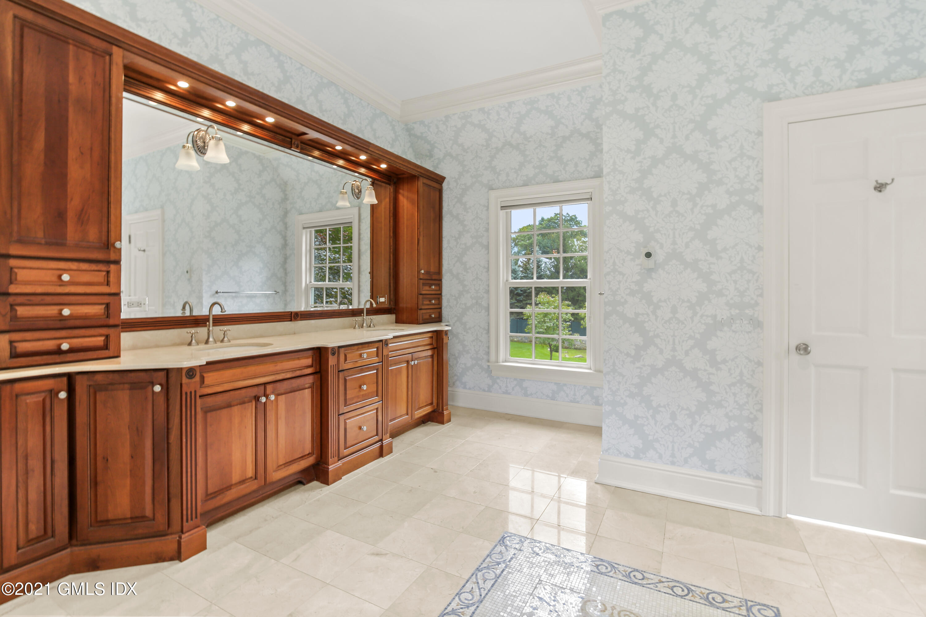 50 Byfield Lane Greenwich, CT 06830 - Photo 19 of 37 a bathroom with a sink mirror and a bathtub