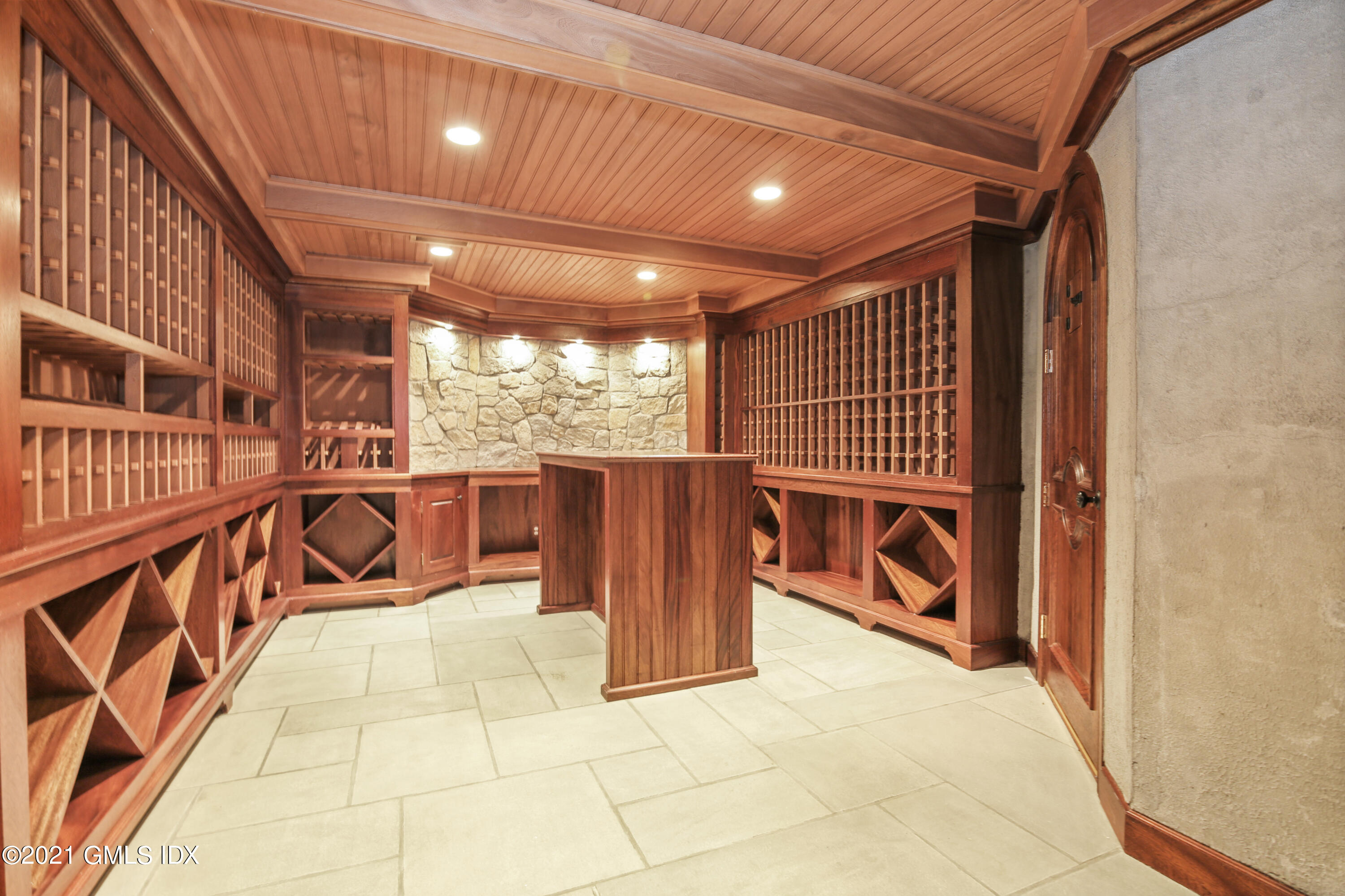 50 Byfield Lane Greenwich, CT 06830 - Photo 29 of 37 a view of a patio with a table and chairs