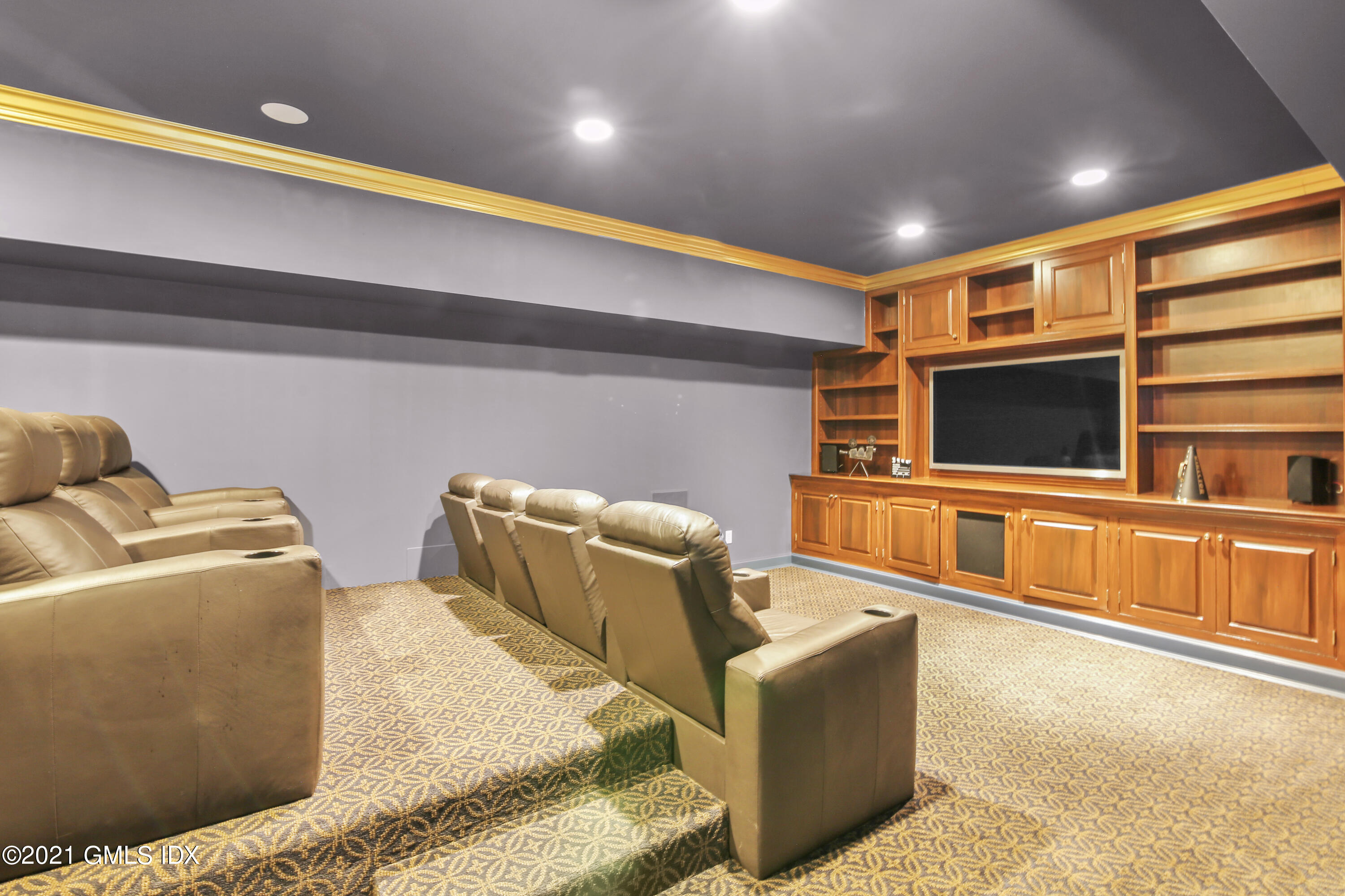 50 Byfield Lane Greenwich, CT 06830 - Photo 30 of 37 a living room with couches and a flat screen tv