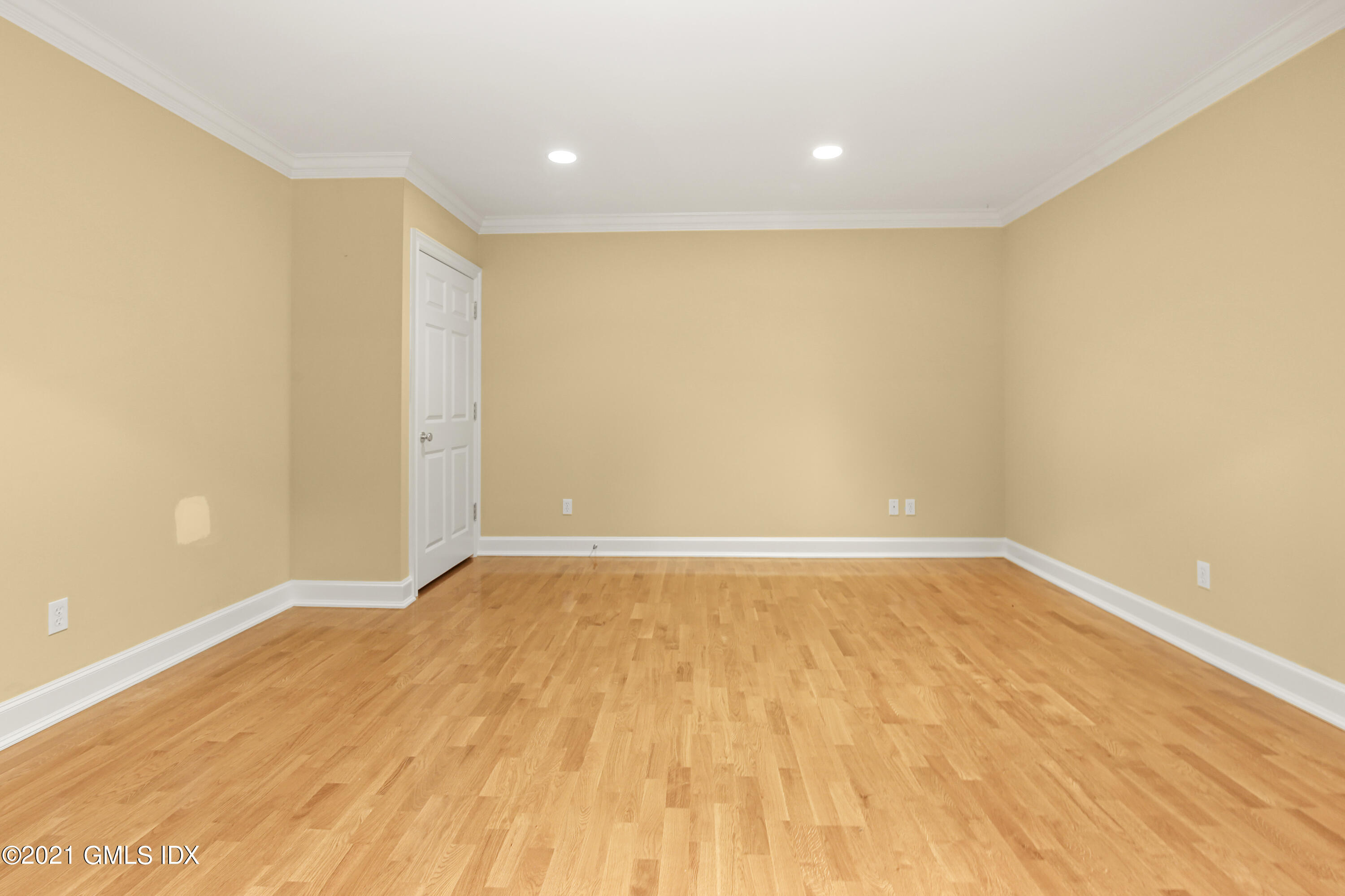 50 Byfield Lane Greenwich, CT 06830 - Photo 33 of 37 a view of an empty room with wooden floor
