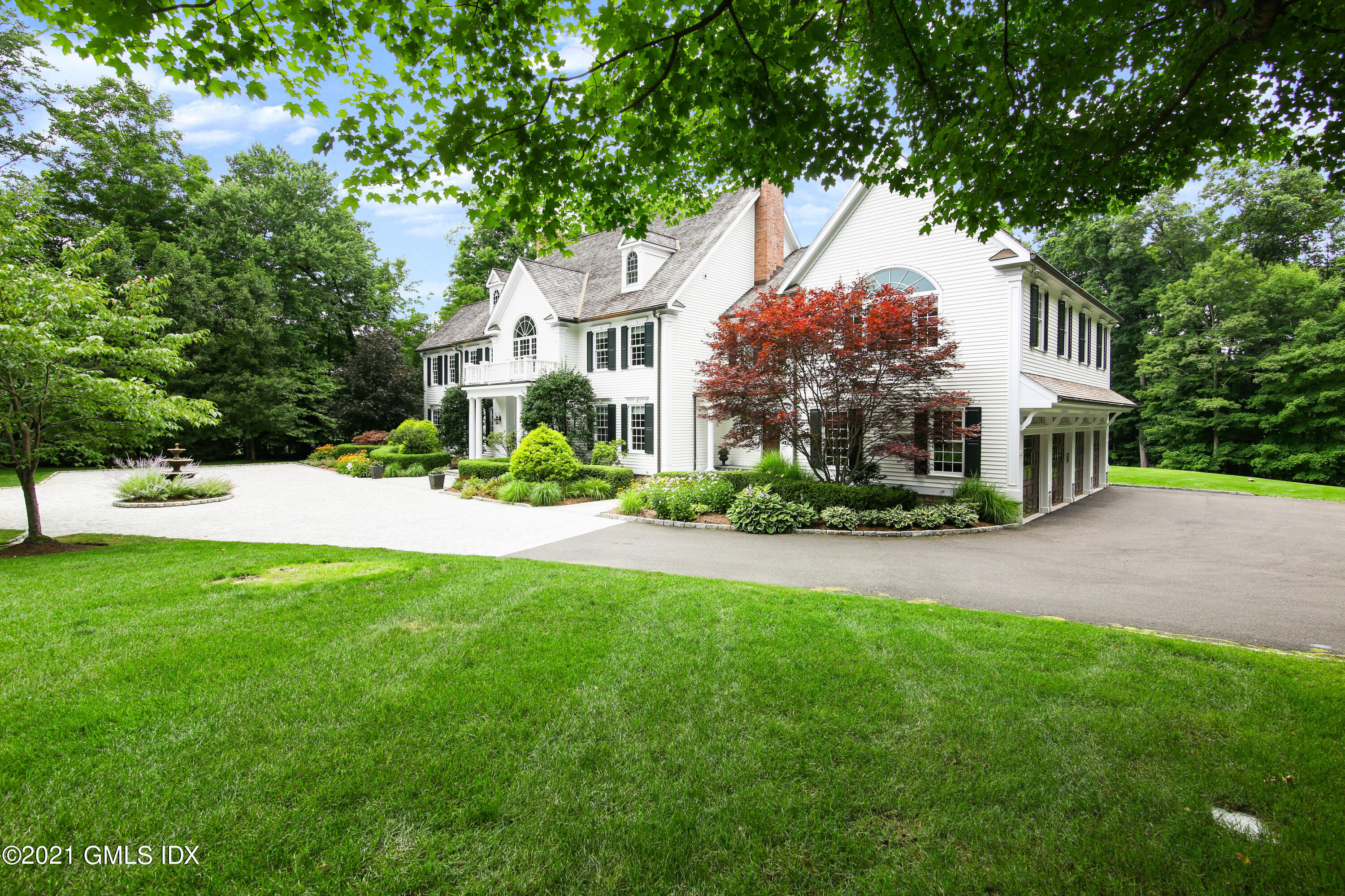 50 Byfield Lane Greenwich, CT 06830 - Photo 9 of 37 a front view of a house with a yard