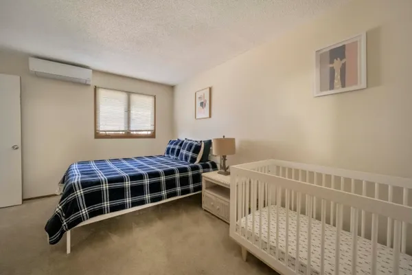 a bedroom with furniture and windows
