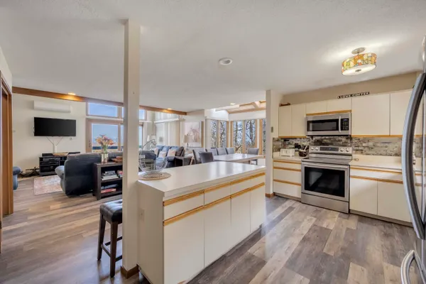 a view of a kitchen with microwave and stove