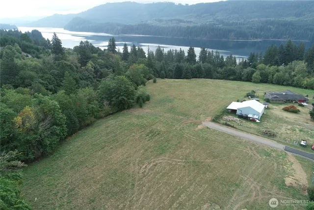 a view of a water pond with green space