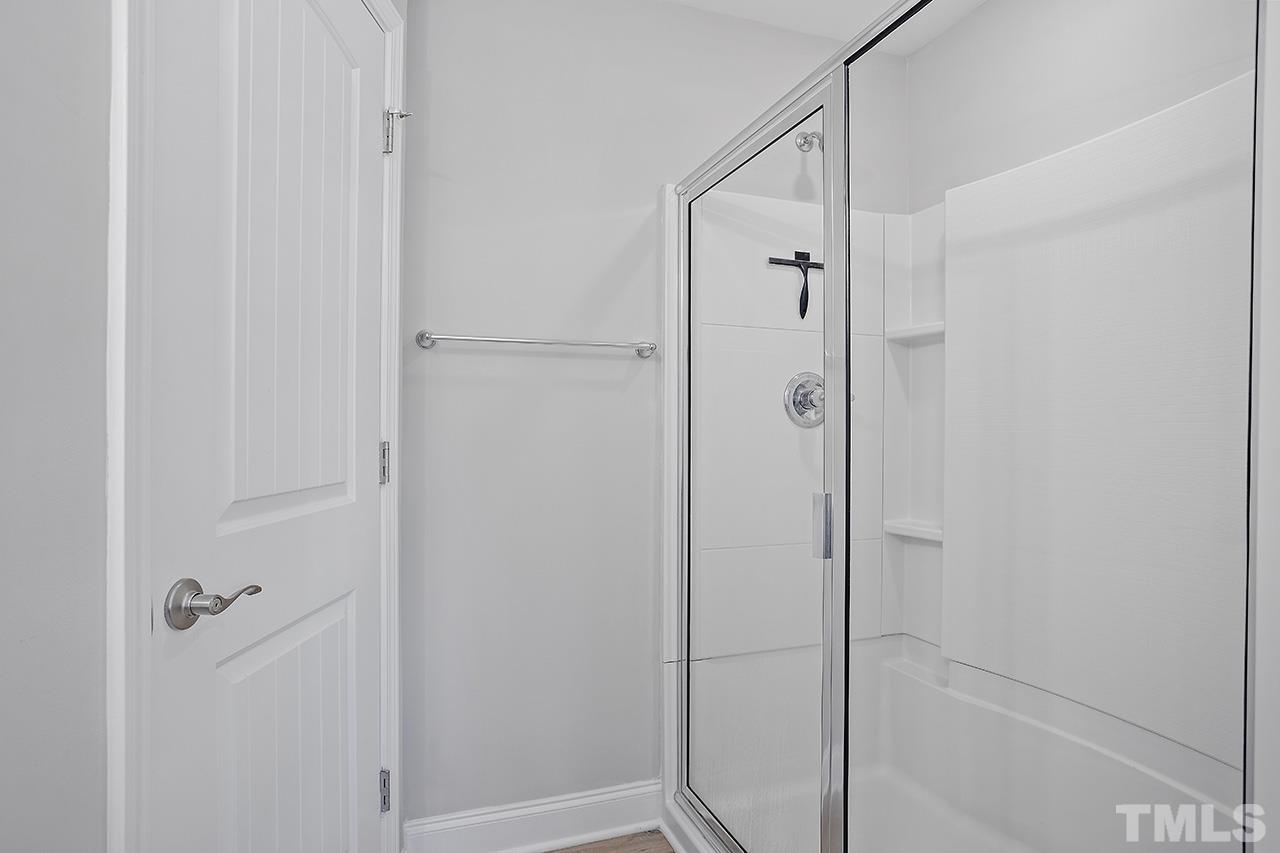 5703 Princess Curry Way Raleigh, NC 27610 - Photo 23 of 33 a bathroom with a shower