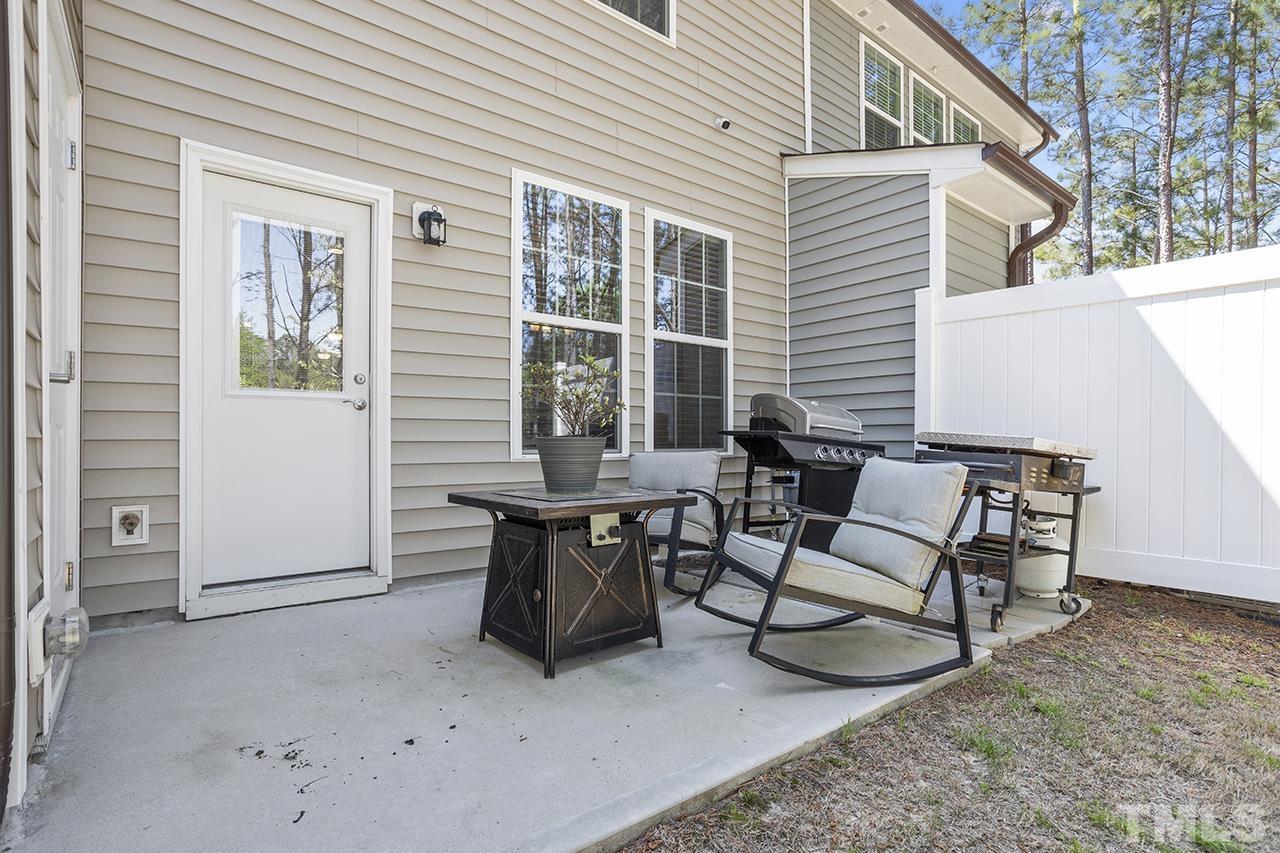 5703 Princess Curry Way Raleigh, NC 27610 - Photo 32 of 33 a view of a house with backyard and sitting area