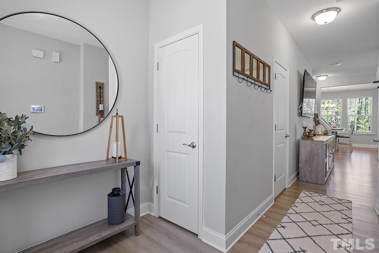 5703 Princess Curry Way Raleigh, NC 27610 - Photo 4 of 33 a view of a hallway with workspace and entryway