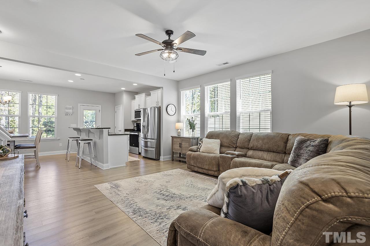 5703 Princess Curry Way Raleigh, NC 27610 - Photo 6 of 33 a living room with furniture and a view of kitchen