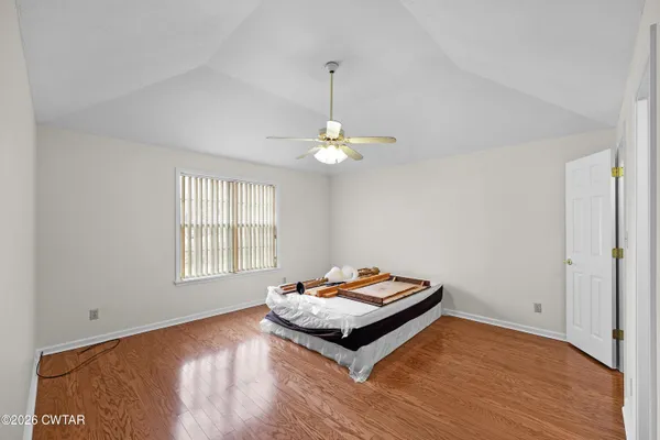 a living room with hard wood floors