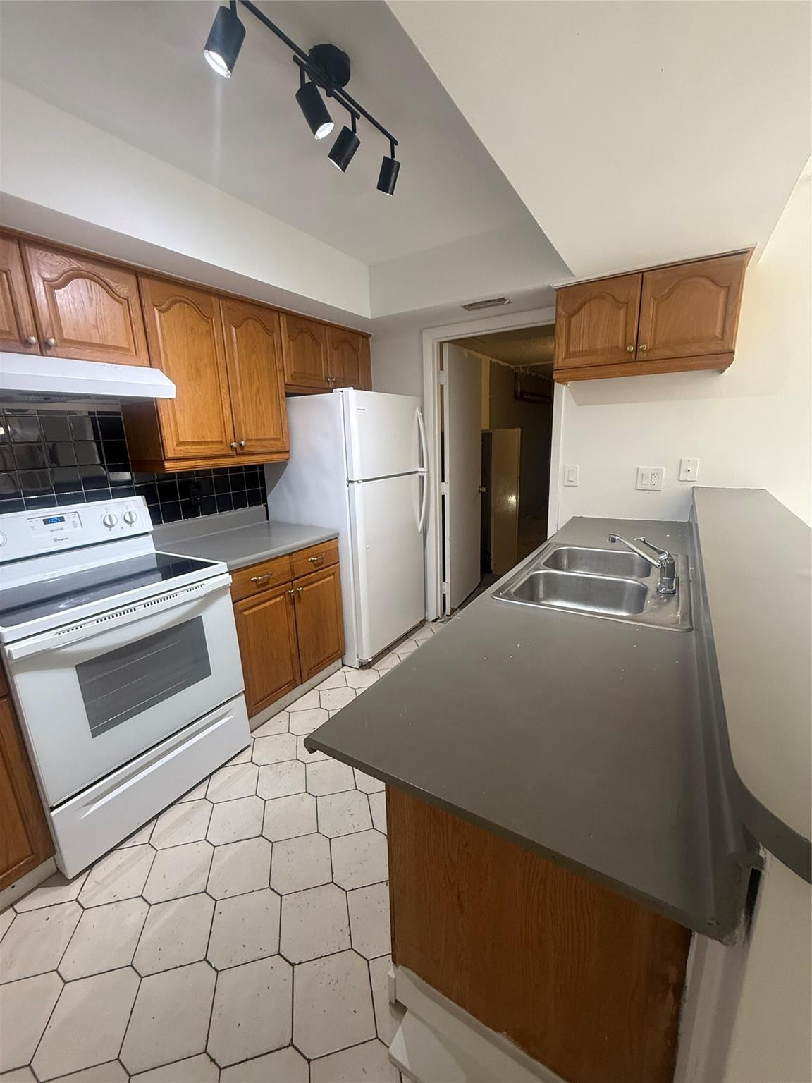 7427 Southwest 13th Street North Lauderdale, FL 33068 - Photo 11 of 49 a view of kitchen with refrigerator and stove