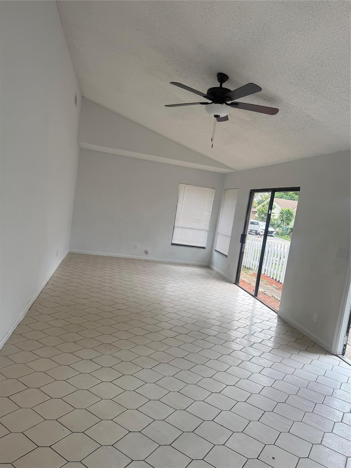 7427 Southwest 13th Street North Lauderdale, FL 33068 - Photo 15 of 49 an empty room with windows and fan