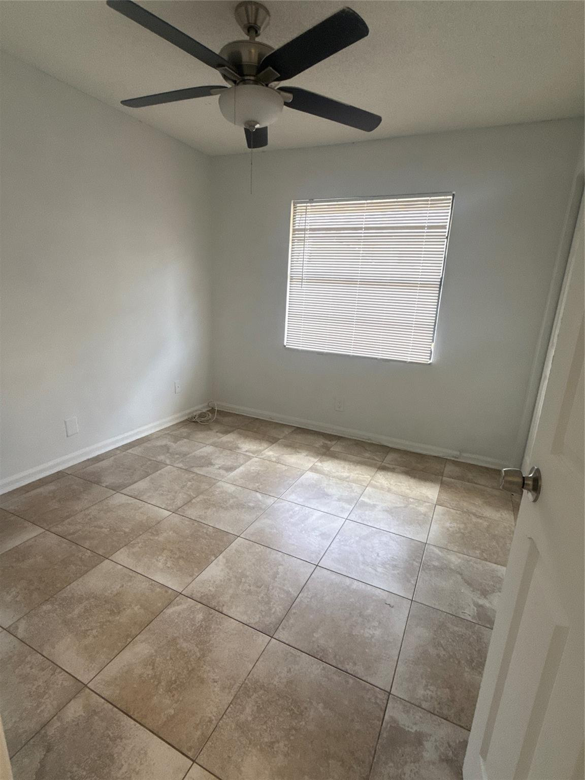 7427 Southwest 13th Street North Lauderdale, FL 33068 - Photo 23 of 49 a view of an empty room with a window