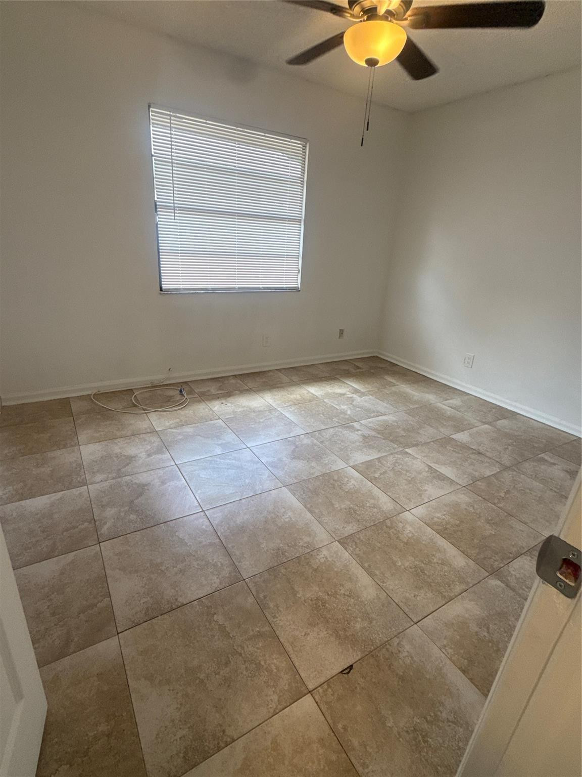 7427 Southwest 13th Street North Lauderdale, FL 33068 - Photo 24 of 49 a view of an empty room with a window