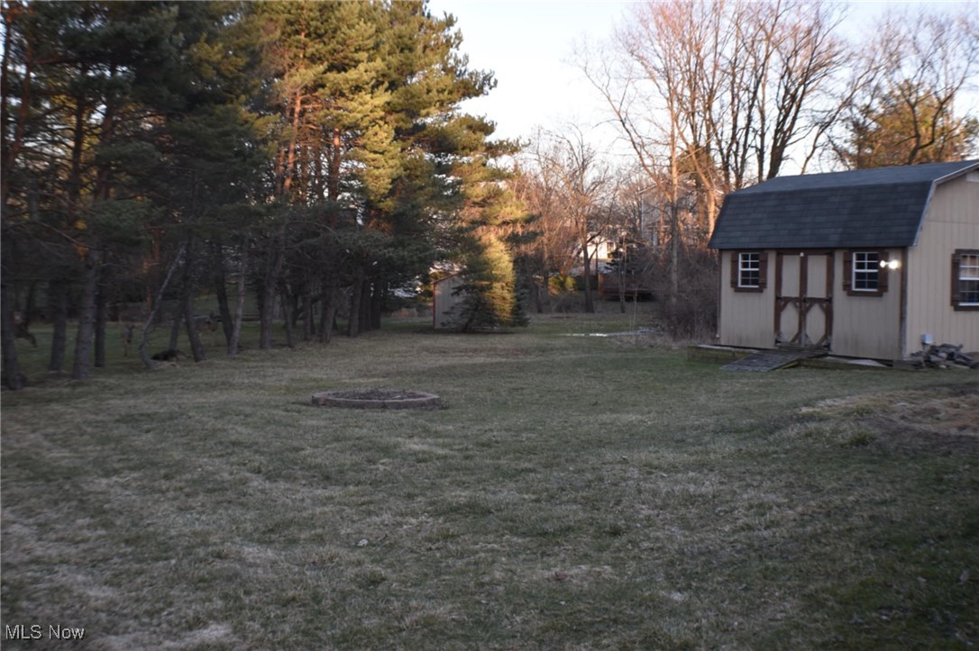 1088 Wadsworth Road Medina, OH 44256 - Photo 21 of 24 View of yard featuring a storage shed and an outdoor structure