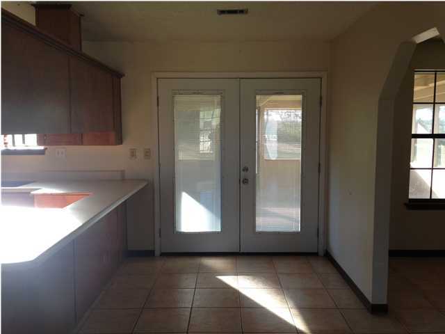 5806 Flamingo Road Crestview, FL 32539 - Photo 9 of 19 a view of a hallway with windows