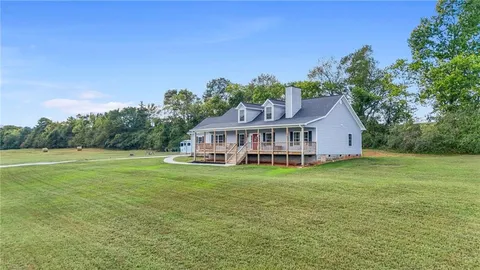 a house with garden in front of it