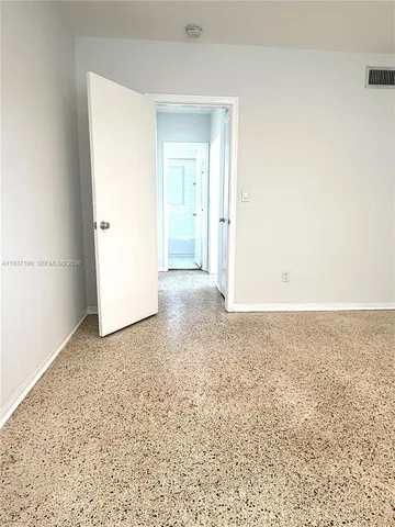 an empty room with an entryway