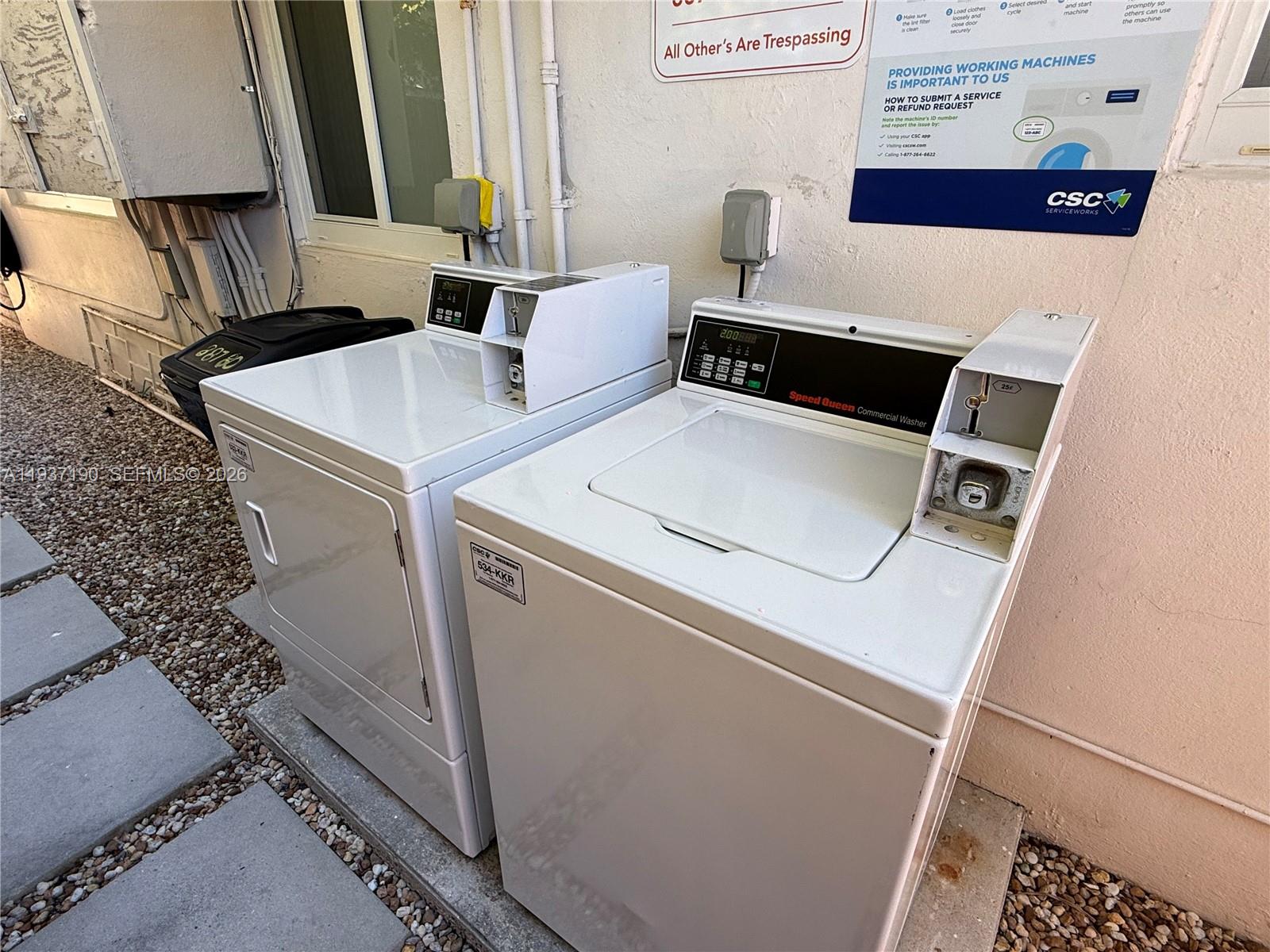 887 80th Street, Unit 1 Miami Beach, FL 33141 - Photo 18 of 19 a utility room with dryer and washer