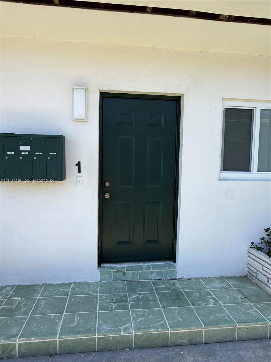 887 80th Street, Unit 1 Miami Beach, FL 33141 - Photo 3 of 19 a bathroom with a shower