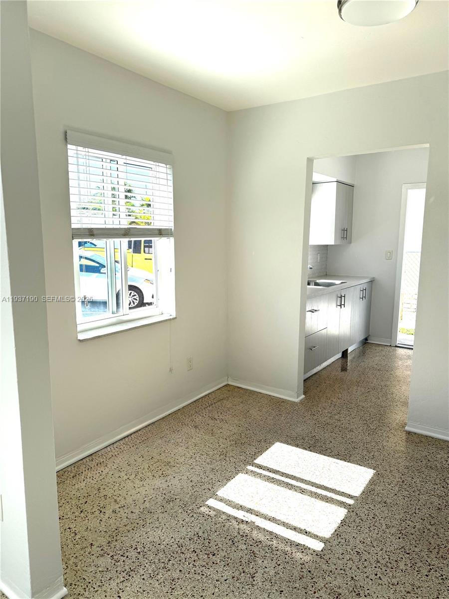 887 80th Street, Unit 1 Miami Beach, FL 33141 - Photo 9 of 19 a room with a bed and a window