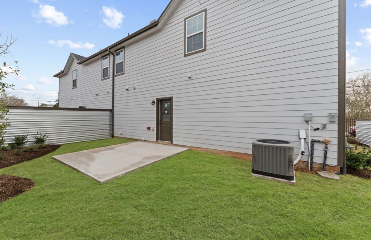 5140 Mallow Street Houston, TX 77033 - Photo 16 of 23 a backyard of a house with oven and green space
