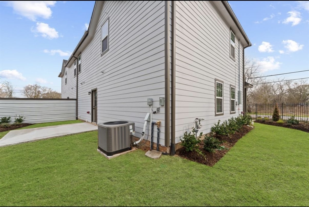 5140 Mallow Street Houston, TX 77033 - Photo 17 of 23 a view of a backyard with plants and large tree